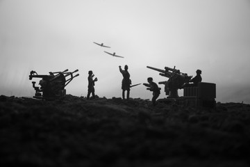 An anti-aircraft cannon and Military silhouettes fighting scene on war fog sky background. Allied air forces attacking on German positions. Artwork decorated scene.