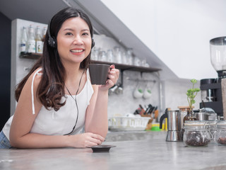 happy asia woman enjoy drinking coffee in coffee shop