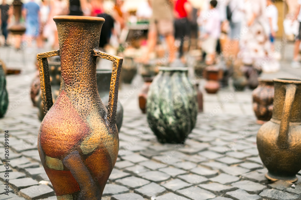 Wall mural Romanian traditional ceramic vases on the pavement