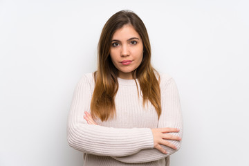 Young girl with white sweater keeping arms crossed