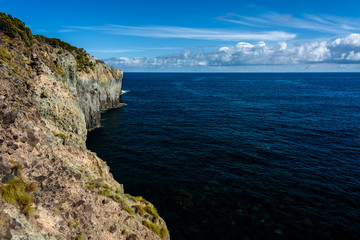 Fototapeta na wymiar seascape with cliff in terceria, view of the coastline in terceira with high cliff. seascape in azores, portugal