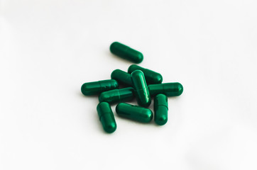 Medicine capsules closeup on white background