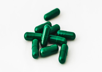 Medicine capsules closeup on white background