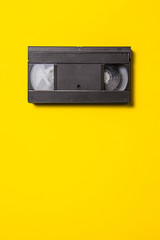 Obraz premium Black classic video tape on a yellow background
