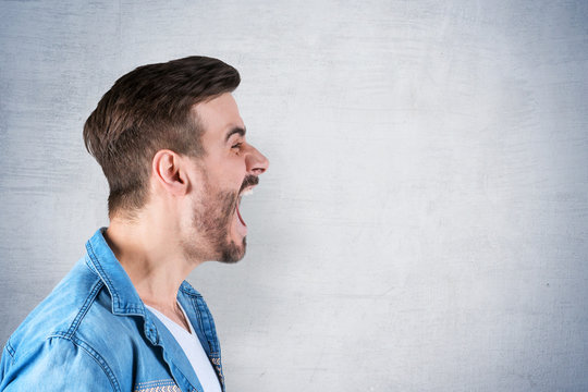 Side View Of Young Man Screaming