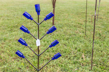 Bottle Tree Lawn Art:  Blue bottle tree Lawn art used it lawn decoration.