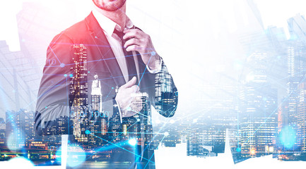 Businessman fixing tie in city, network hologram