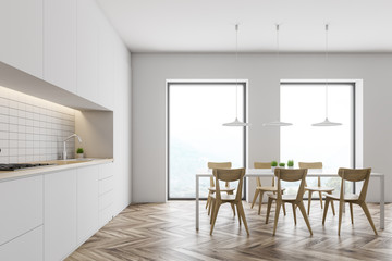 Naklejka na ściany i meble Loft white kitchen with table and countertops