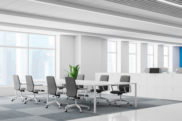 Office boardroom interior with long white table