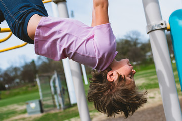 Girl on monkey bars