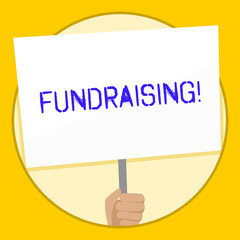 Text sign showing Fundraising. Business photo text seeking to generate financial support for charity or cause Hand Holding Blank White Placard Supported by Handle for Social Awareness