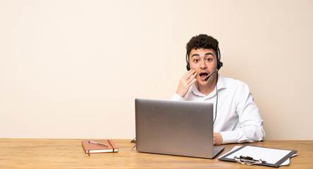 Telemarketer man with surprise and shocked facial expression