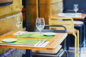 Empty wine glasses on street bar table in San Sebastian