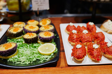 Variety of pinchos (pintxos) in bar of San Sebastian (Donostia), Spain