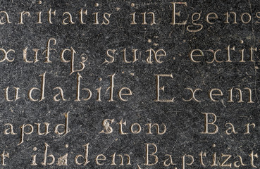 Seamless old memorial letters and words carved into stone.
