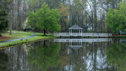 Gazebo on bridge going over pond