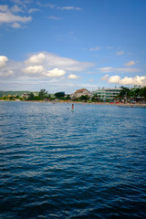 Fototapeta premium Woman practicing Stand Up paddle boarding