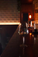 Wine glass with water at the bar
