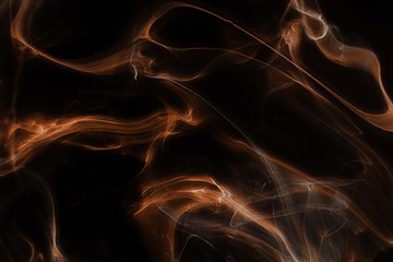 Orange foggy paper texture on the black background, smoky effect for photos and artworks. Chaotic abstract background.