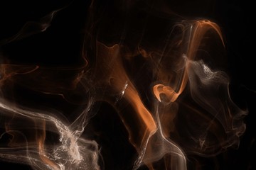 Orange foggy paper texture on the black background, smoky effect for photos and artworks. Chaotic abstract background.