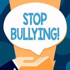 Writing note showing Stop Bullying. Business concept for no aggressive behavior among children power imbalance Palm Up in Supine position Donation Hand Sign Speech Bubble