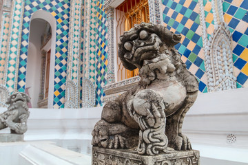 Fototapeta na wymiar Detail of Lion guardian on Wat Phra Kaew, Temple of the Emerald Buddha Wat Phra Kaew is one of Bangkok's most famous tourist sites and it was built in 1782 at Bangkok, Thailand