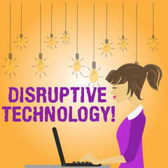 Writing note showing Disruptive Technology. Business concept for one that displaces an established technology photo of Young Busy Woman Sitting Side View and Working on her Laptop