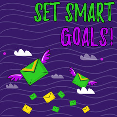 Text sign showing Set Smart Goals. Business photo showcasing list to clarify your ideas focus efforts use time wisely Many Colorful Airmail Flying Letter Envelopes and Two of Them with Wings