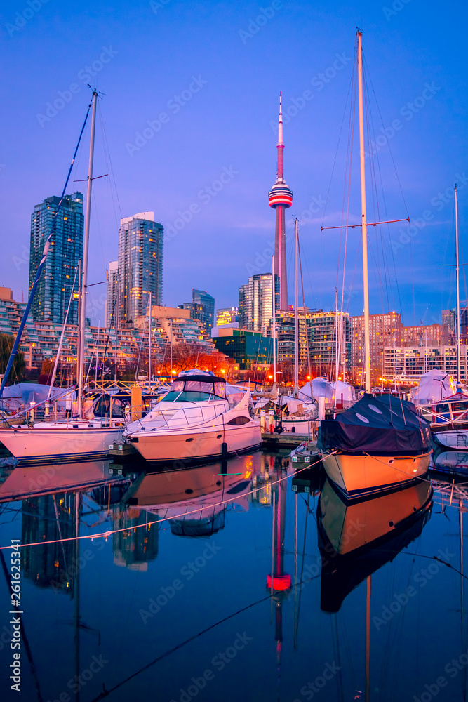 Wall mural Blue hour at Toronto harbor with CN tower and high rise buildings as background