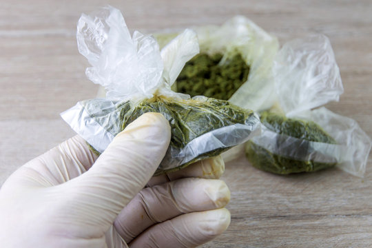 carcinogenic chewing tobacco called "nasvay", "nas", "nos" produced in Tajikistan, Uzbekistan and Kazakhstan, in the hand of a medic, short focus