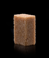 Sugar cube on black background