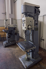 Industrial drilling machine tools in factory workshop