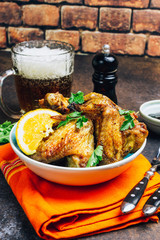 Chicken wings on barbecue grill.