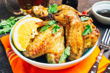 Chicken wings on barbecue grill.