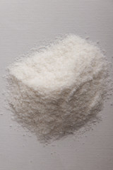 mineral diet: a small pile of sea iodized edible salt on a plate, short focus, toning