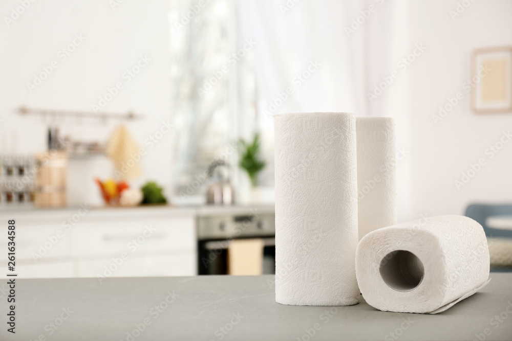 Wall mural Rolls of paper towels on table in kitchen