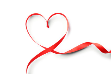 Heart made of red ribbon on white background, top view. Festive decoration