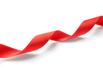 Simple red ribbon on white background. Festive decoration