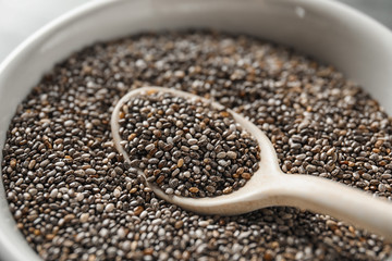 Closeup of bowl and spoon with chia seeds
