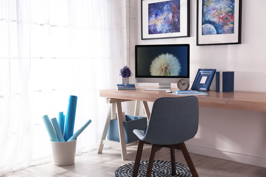 Modern workplace interior with computer on table