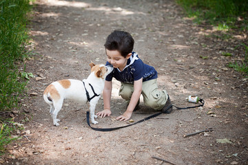 dog kissing toddler