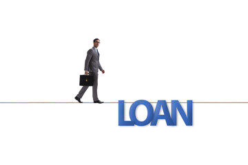 Debt and loan concept with businessman walking on tight rope