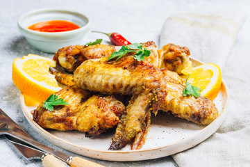 Chicken wings on barbecue grill.