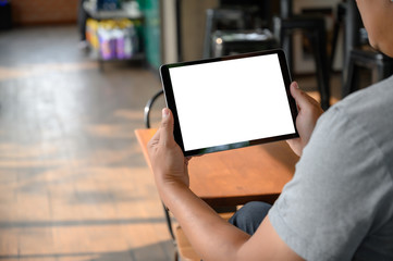 businessman hand working on tablet on wooden desk tablet with blank screen mockup Digital tablet computer