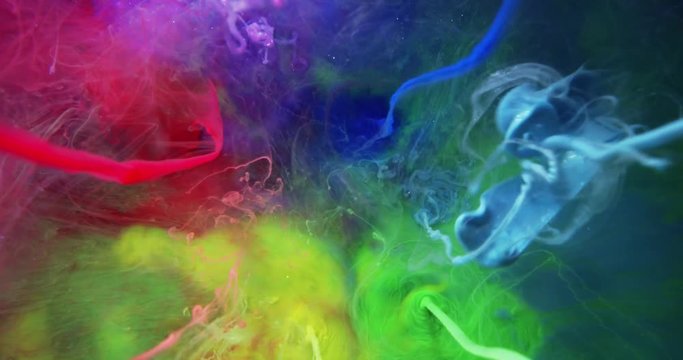 Colorful Rainbow Paint  Threads and Drops Mixing in Water. Ink swirling. Underwater 4K Macro Shot.