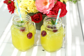 glass of champagne with strawberry and flowers