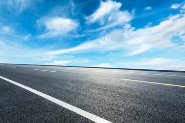 Empty asphalt road ground and blue sky with white clouds scene