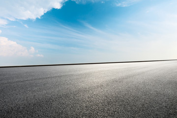 Empty asphalt road ground and blue sky with white clouds scene