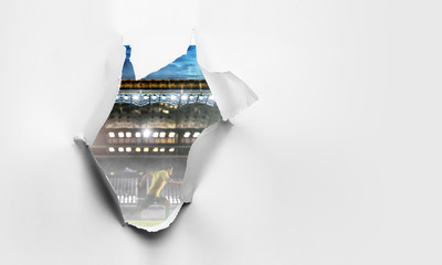 Paper torn hole effect with stadium view. Mixed media