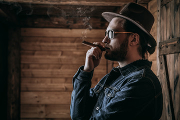 man smokes cigar